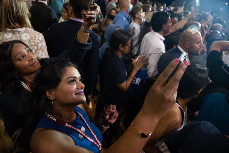 Audience members taking selfies